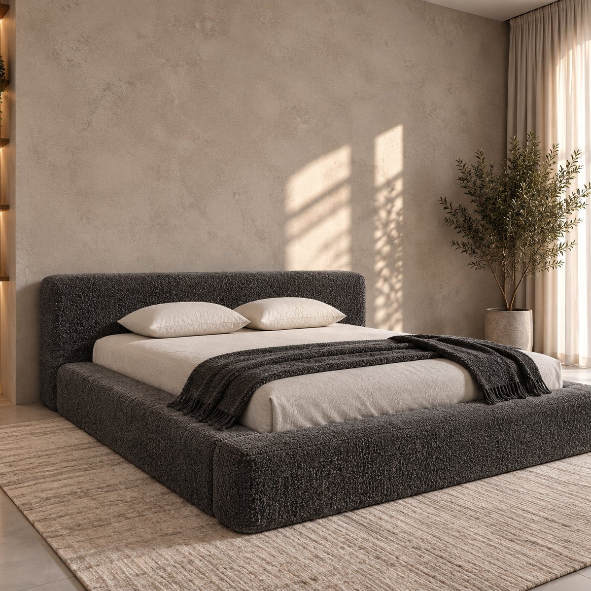 Merano bed in granite bouclé, side view