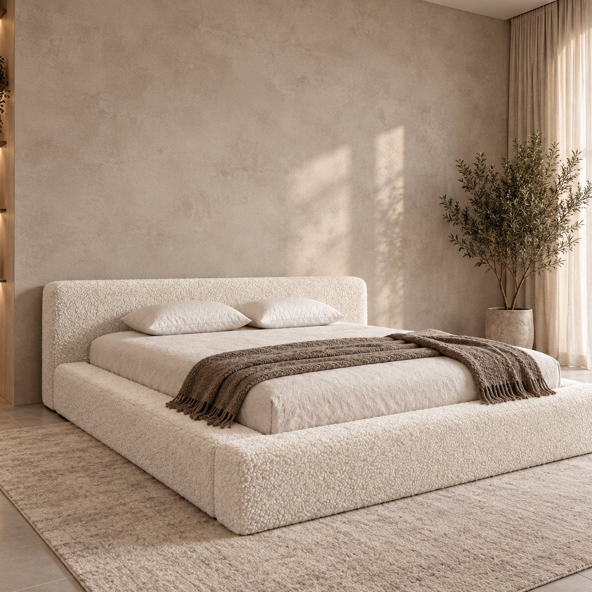 Merano bed in ivory bouclé, side view